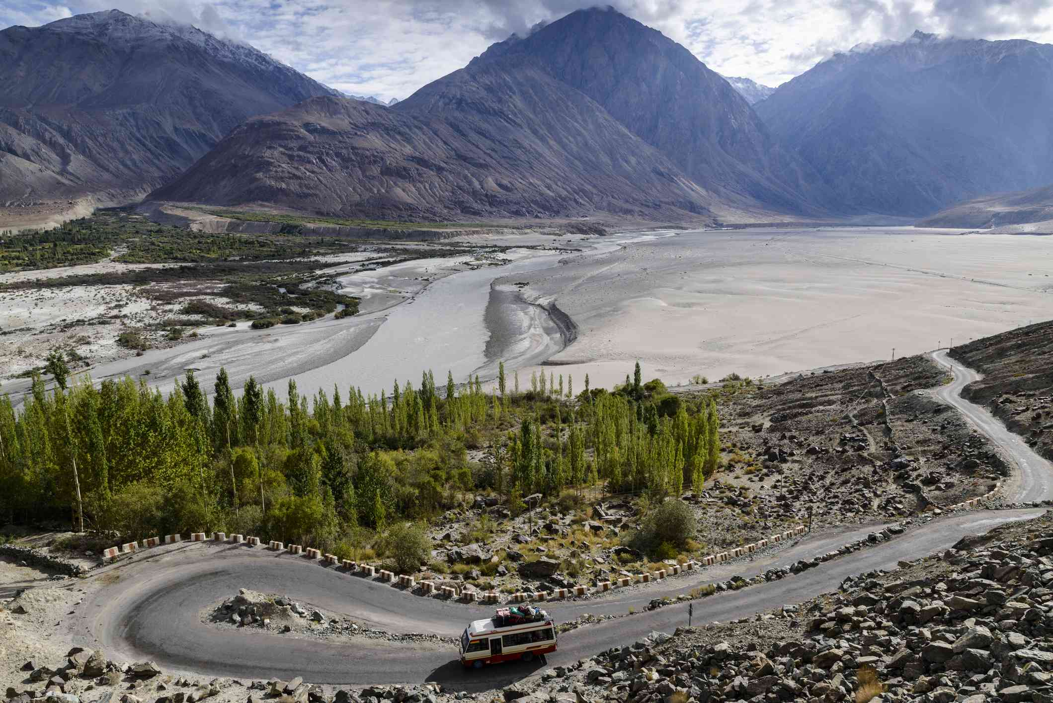After breakfast at Hotel you will be proceed to Nubra Vallry by Crossing Khardung-la Pass (The highest motor able road in the world 5602 m). On the way, you have amazing panoramic view of Indus valley, Shayok River, Himalayan Mountains and Karakoram Mountains range. Explore the Nubra valley (The valley of flowers). ArriveHunder where you enjoy the Double humped bacterian camel riding (Optional). After that continue driving to Deskit (administrative block of Nubra valley) and visit the monastery. This picturesque monastery built on hill top overlooking the valley. Enjoy magnificent and awesome view of valley and mountains of Karakoram Range. The most attractive features of Nubra valley is the sand dune. Return back to Leh for overnight stay.