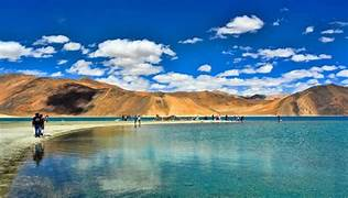 After breakfast at Hotel full day excursion to Pangong Lake by Crossing Chang-la pass (The world's third highest motorable road 5360 m). On the way, you have amazing view of charming villages, beautiful mountains, animals like Yaks, nomads and beautiful valley of Changthang. Arrive at Lake, the Lake is 136 kms long and 5 kms wide, 47% of this lake is in India and rest is in Tibet. The view of lake is spectacular and breathtaking. Enjoy the unforgettable scenery beauty of Lake and the voice of Himalayan migrant birds. In the evening back to the hotel. Overnight at Hotel